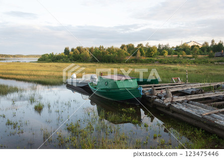 Old wooden boats at the riverbank Old wooden boats at the riverbank 123475446