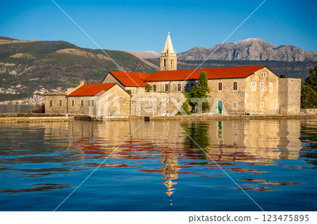 View of Our Lady of Mercy Island from yacht boat near Tivat city in Kotor bay of Adriatic sea in Montenegro in winter time View of Our Lady of Mercy Island from yacht boat near Tivat city in Kotor bay of Adriatic sea in Montenegro in winter time 123475895
