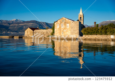 View of Our Lady of Mercy Island from yacht boat near Tivat city in Kotor bay of Adriatic sea in Montenegro in winter time View of Our Lady of Mercy Island from yacht boat near Tivat city in Kotor bay of Adriatic sea in Montenegro in winter time 123475912