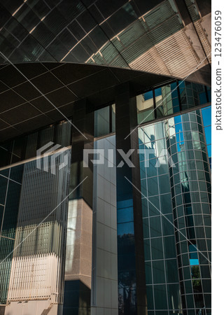 modern architecture showcases sleek lines and reflective surfaces in urban environment 123476059