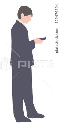 A young man in a suit looking at his smartphone A young man in a suit looking at his smartphone 123476304