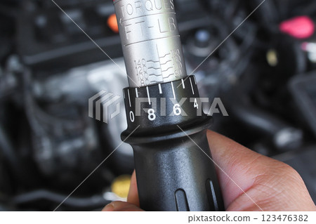 Close up of scale torque adjuster of torque wrench Close up of scale torque adjuster of torque wrench 123476382