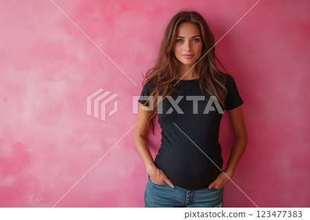 Model posing against a pink wall in casual outfit 123477383
