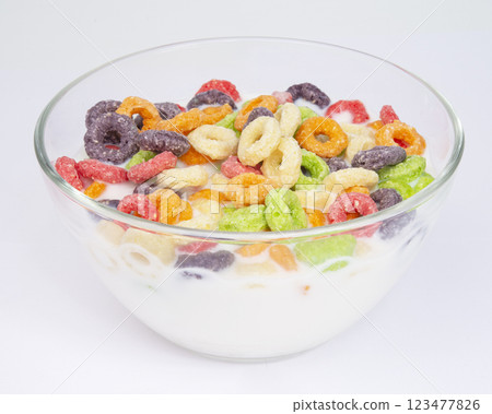 colored breakfast cereals laid out in a bowl on the white background top view, children's healthy breakfast colored breakfast cereals laid out in a bowl on the white background top view, children's healthy breakfast 123477826