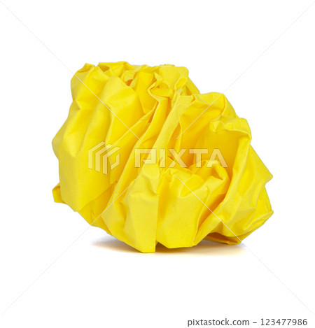 Yellow crumpled craft ball paper isolated on the white background Yellow crumpled craft ball paper isolated on the white background 123477986
