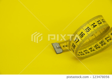 Tape measure sew diet colorful background with copyspace Tape measure sew diet colorful background with copyspace 123478056