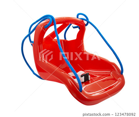 Plastic orange swing for children isolated on the white background Plastic orange swing for children isolated on the white background 123478092