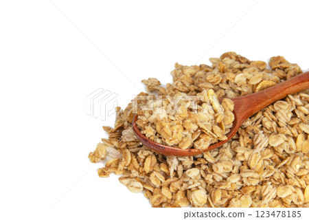 Oatmeal cereal breakfast in wooden spoon isolated on the white background 123478185