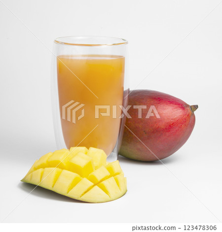 Mango fruit juice in glass isolated on the white 123478306