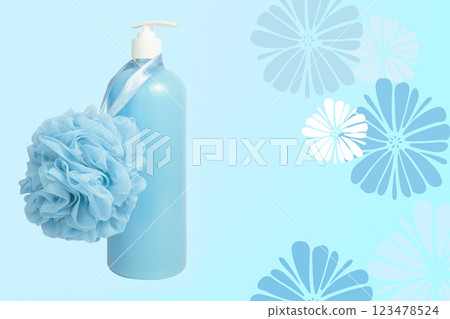 Blue shower gel bottle and sponge for bath postcard background 123478524