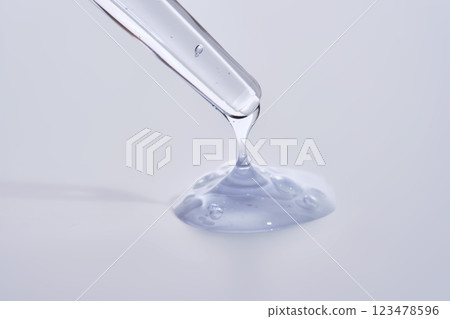 Pipette with delicate blue serum close-up. 123478596