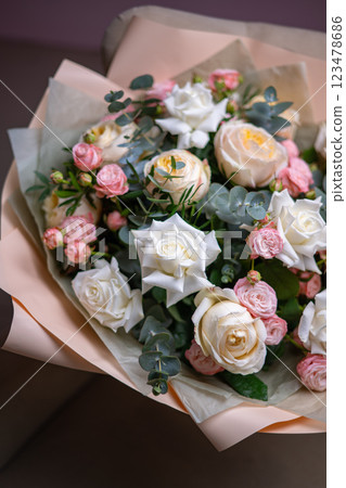 Delicate composition of white and pink roses in a basket Delicate composition of white and pink roses in a basket 123478686