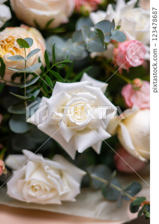 Delicate composition of white and pink roses in a basket Delicate composition of white and pink roses in a basket 123478687