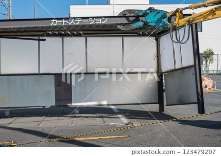 Heavy machinery removing the cart parking area Heavy machinery removing the cart parking area 123479207