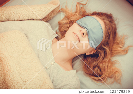 Sleeping woman wearing blindfold sleep mask. Sleeping woman wearing blindfold sleep mask. 123479259