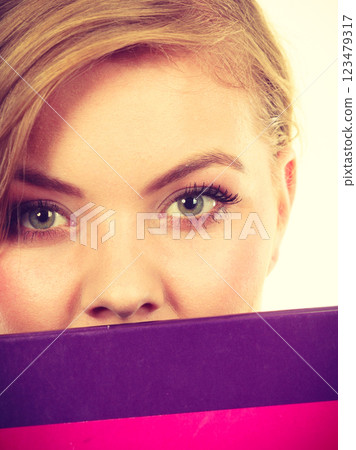 Young teenage student with braid holding books Young teenage student with braid holding books 123479317