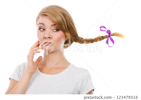 Sad teenage girl in windblown braid hair 123479318