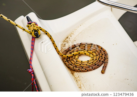 Cleat with line on boat. Yacht detail 123479436