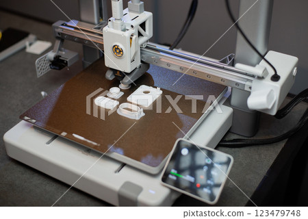 3D printer prints small parts. Prototyping concept 123479748