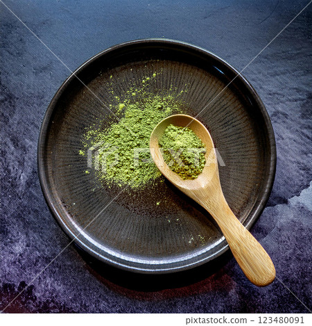 Rustic Matcha Powder on Dark Plate Rustic Matcha Powder on Dark Plate 123480091