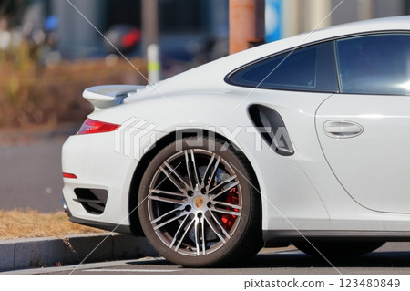Image of a sports car in a parking lot 123480849