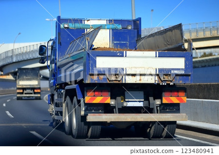 Image of a dump truck traveling on the highway 123480941