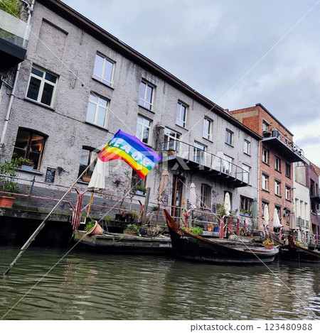The City of Gent, Belgium, Europe. Boats, LGBTQ flag. Trip through the channel  123480988