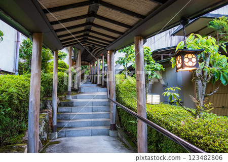 A corridor of a Japanese-style inn with beautiful hanging lanterns A corridor of a Japanese-style inn with beautiful hanging lanterns 123482806