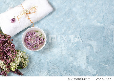 Spa and wellness composition with lilac flowers aromatic water in porcelain bowl on blue background, aromatherapy and skin and body care, flat lay, top view, lifestyle concept and modern woman, Spa and wellness composition with lilac flowers aromatic water in porcelain bowl on blue background, aromatherapy and skin and body care, flat lay, top view, lifestyle concept and modern woman, 123482856