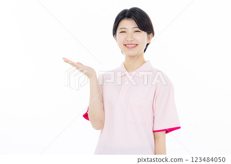 Smiling caregiver giving instructions Smiling caregiver giving instructions 123484050