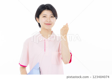 Smiling caregiver giving instructions 123484074