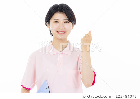 Smiling caregiver giving instructions 123484075