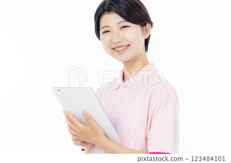 Caregiver with tablet 123484101