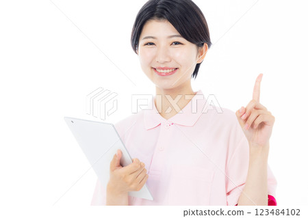 Caregiver with tablet 123484102