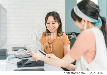 A woman who works as a photo editor, image editor, photo processor, retoucher, and graphic designer A woman who works as a photo editor, image editor, photo processor, retoucher, and graphic designer 123484466