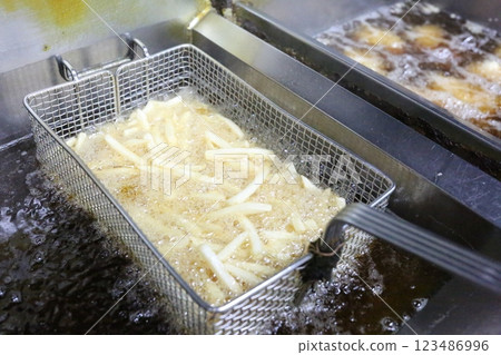 Fried food in a fryer 123486996