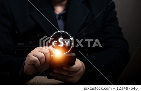 Currency exchange money transfer concept. Businessman searching virtual global currency exchange, foreign currency, international money transfer, financial online banking payment by mobile phone. Currency exchange money transfer concept. Businessman searching virtual global currency exchange, foreign currency, international money transfer, financial online banking payment by mobile phone. 123487640
