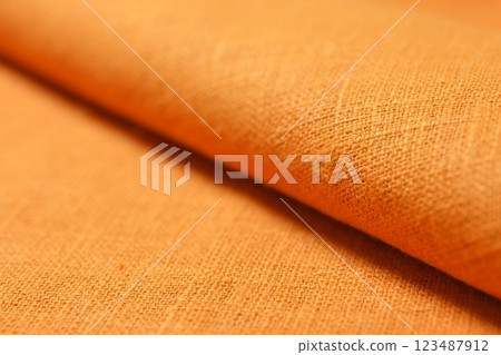 orange hemp viscose natural fabric cloth color, sackcloth rough texture of textile fashion 123487912