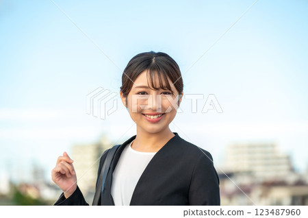 Smiling businesswoman outside Smiling businesswoman outside 123487960