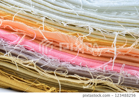 stack of colourful cotton clothes, close up pile of clothing 123488256