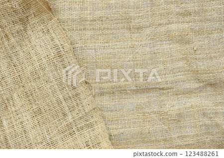 brown sackcloth texture background, crumpled burlap fabric textile for design 123488261