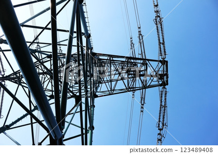Electricity transmission tower seen from below Electricity transmission tower seen from below 123489408