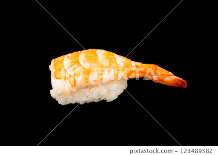 Shrimp nigiri sushi isolated on black background. Black tiger prawn sushi isolated. 123489582