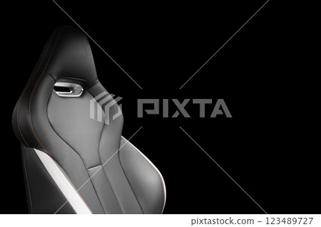 Black leather interior of the luxury modern car. Perforated black leather. Seats with stitching isolated on black background. Modern car interior details. Car inside Black leather interior of the luxury modern car. Perforated black leather. Seats with stitching isolated on black background. Modern car interior details. Car inside 123489727