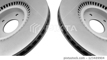 Car brake disc isolated on white background. Auto spare parts. Perforated brake disc rotor isolated on white. Braking ventilated discs. Quality spare parts for car service or maintenance 123489904