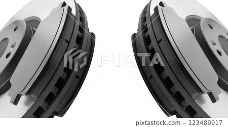 Brake discs and brake pads isolated on white background. Auto parts. Brake disc rotor isolated on white. Braking disk. Car part. Quality spare parts for car service or maintenance Brake discs and brake pads isolated on white background. Auto parts. Brake disc rotor isolated on white. Braking disk. Car part. Quality spare parts for car service or maintenance 123489917