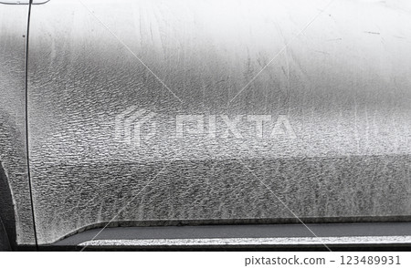 Side view of a very dirty car. Fragment of a dirty car. Dirty headlights, wheel and bumper of the car with swamp splashes on a side panel Side view of a very dirty car. Fragment of a dirty car. Dirty headlights, wheel and bumper of the car with swamp splashes on a side panel 123489931