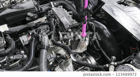 Cleaning car with  brush. Car detailing. Worker cleaning. Car cleaning concept 123489972