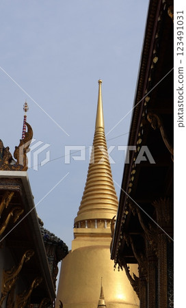 Golden pagoda with blue sky background 123491031