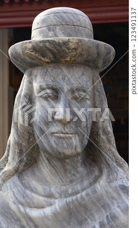 A stone sculpture carved into the shape of a human figure A stone sculpture carved into the shape of a human figure 123491137